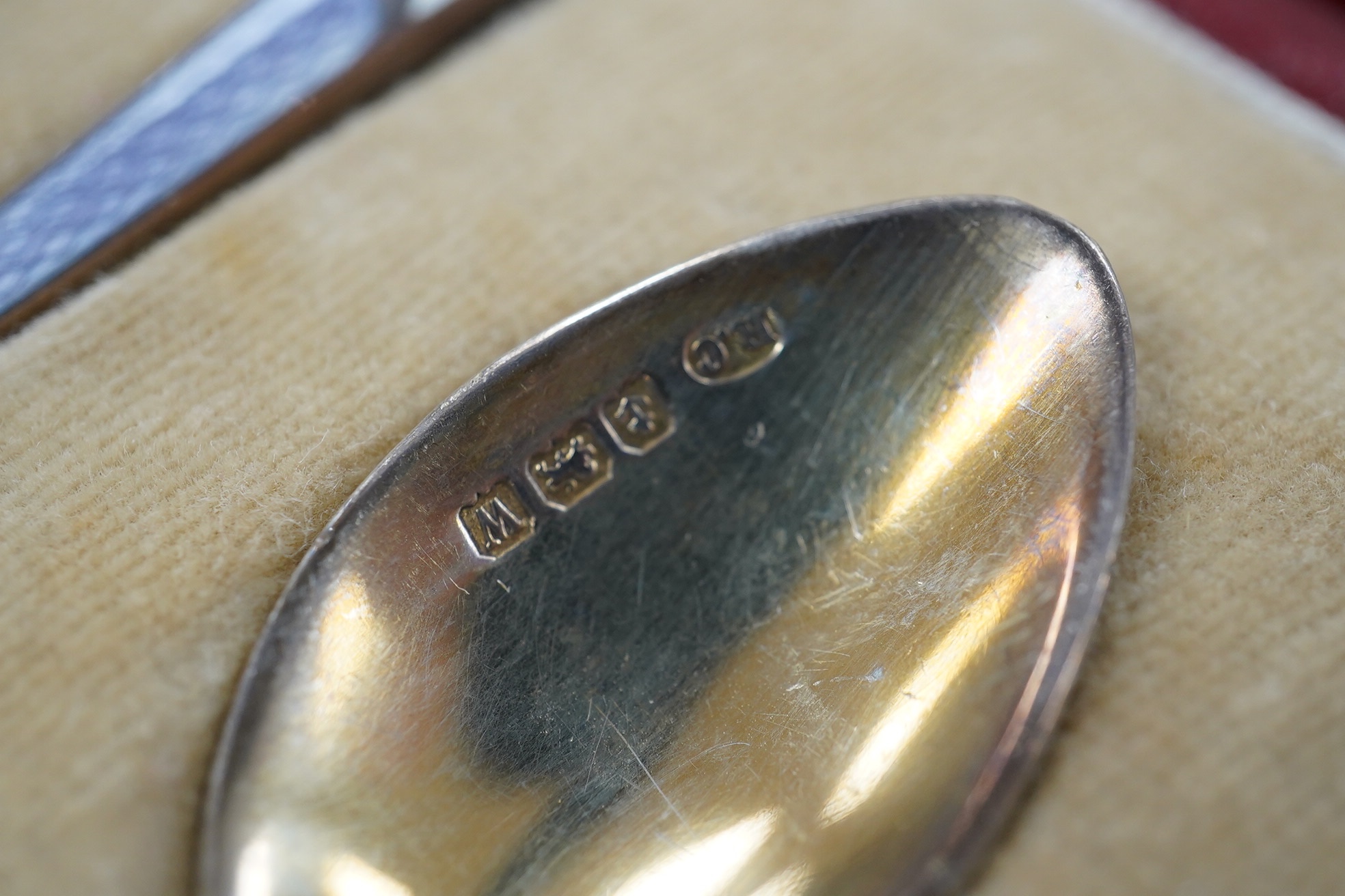 Two cased sets of six silver teaspoons, including enamelled. Condition - poor and good